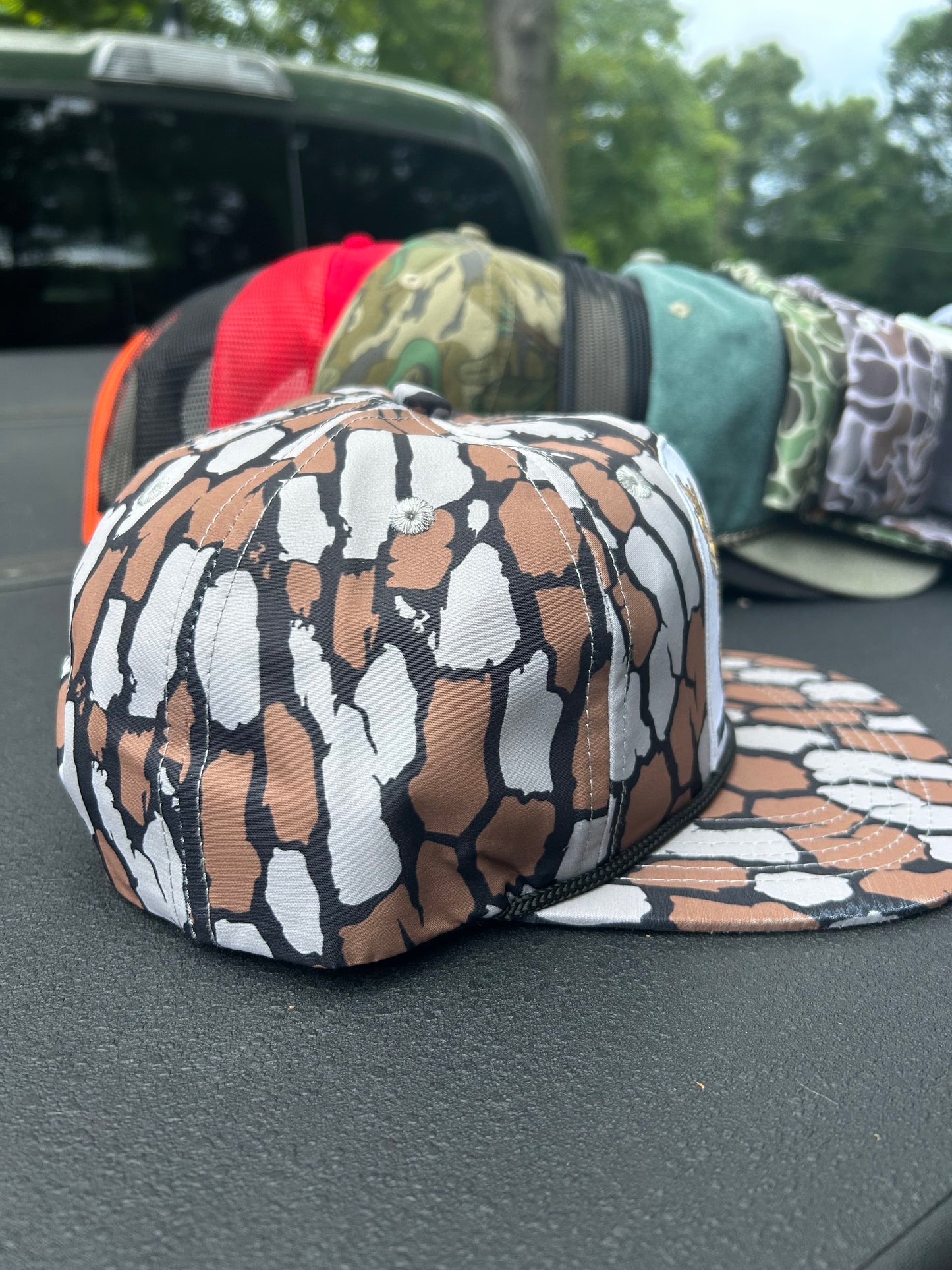 Banjo Brand smokin’whitetail patch on a oak Camo rope brim snapback hat