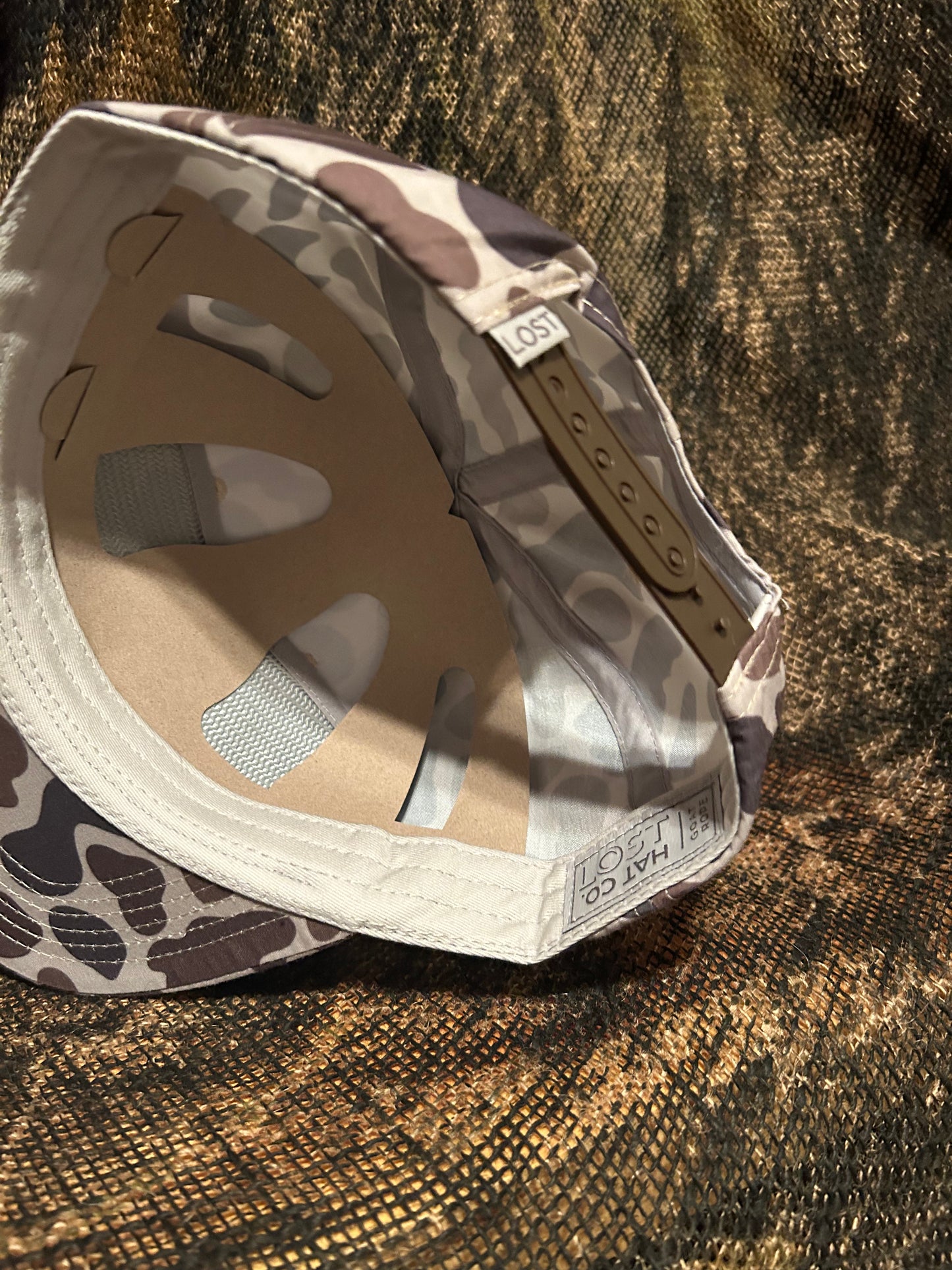 Banjo Brand leather patch on a retro camo SnapBack hat