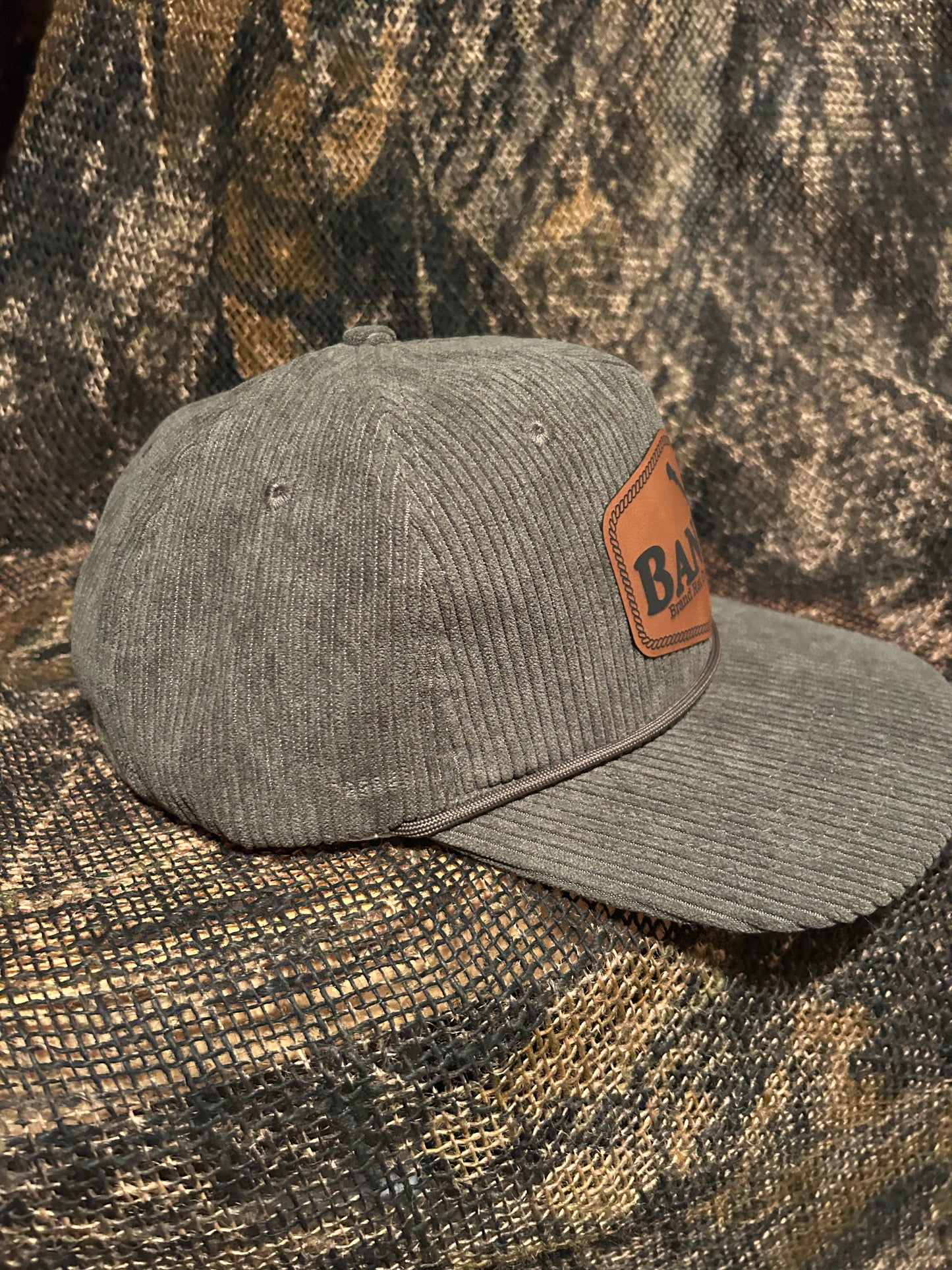 Banjo Brand leather patch on your choice of Corduroy SnapBack hat