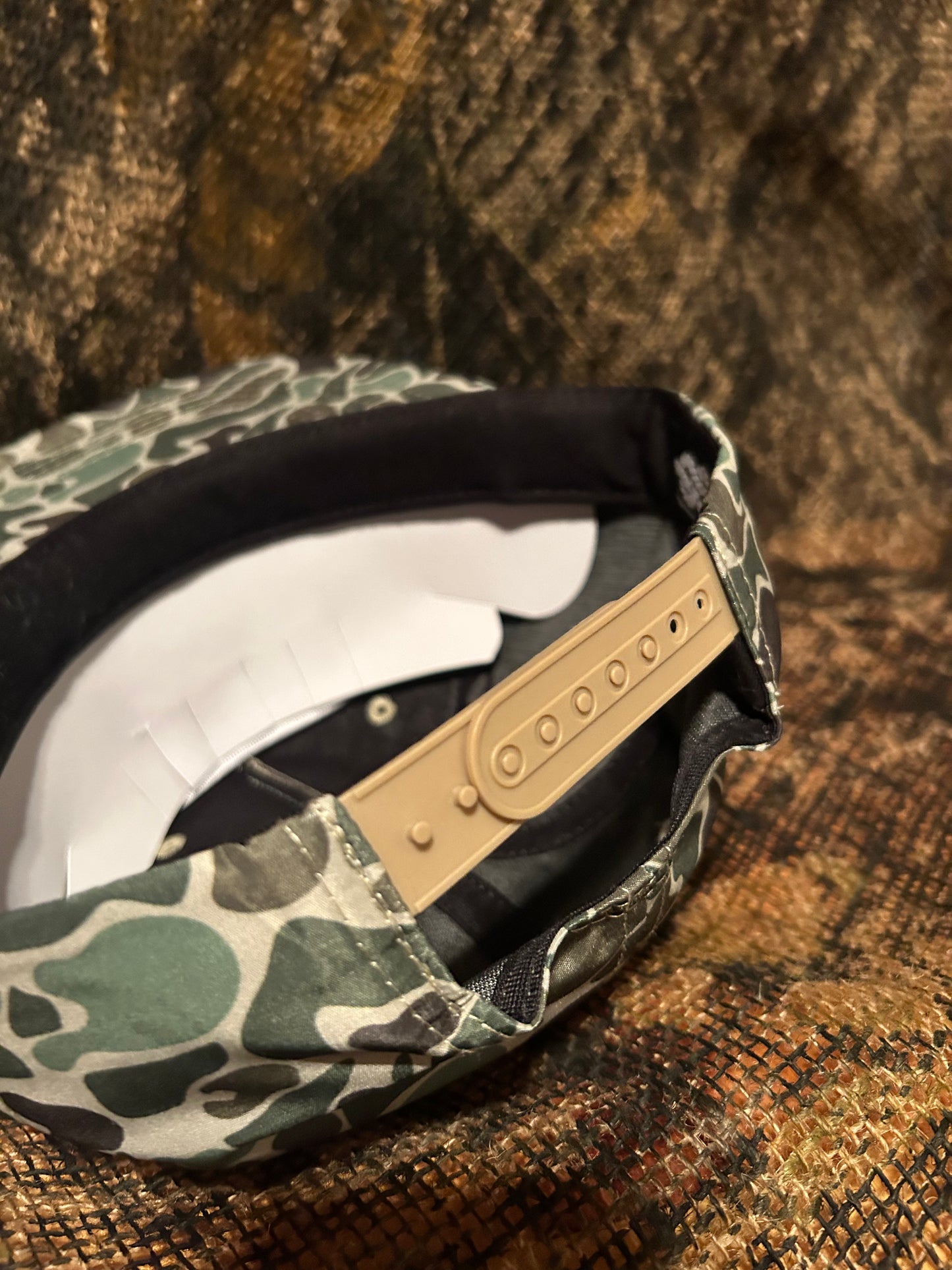 Banjo Brand script patch on a jungle Camo rope brim SnapBack hat