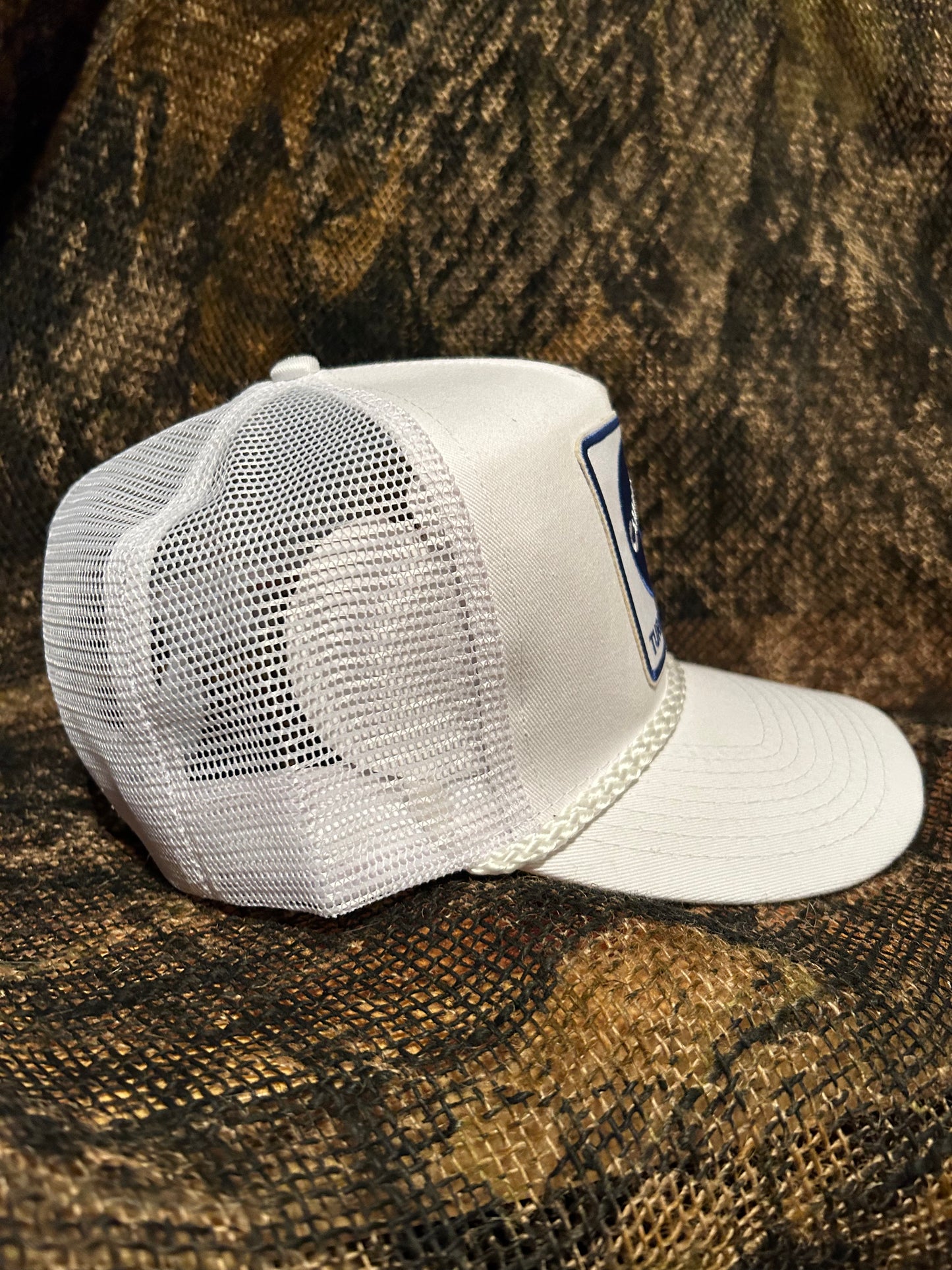 Cummins Turbo Diesel patch on a all white Ropebrim SnapBack hat