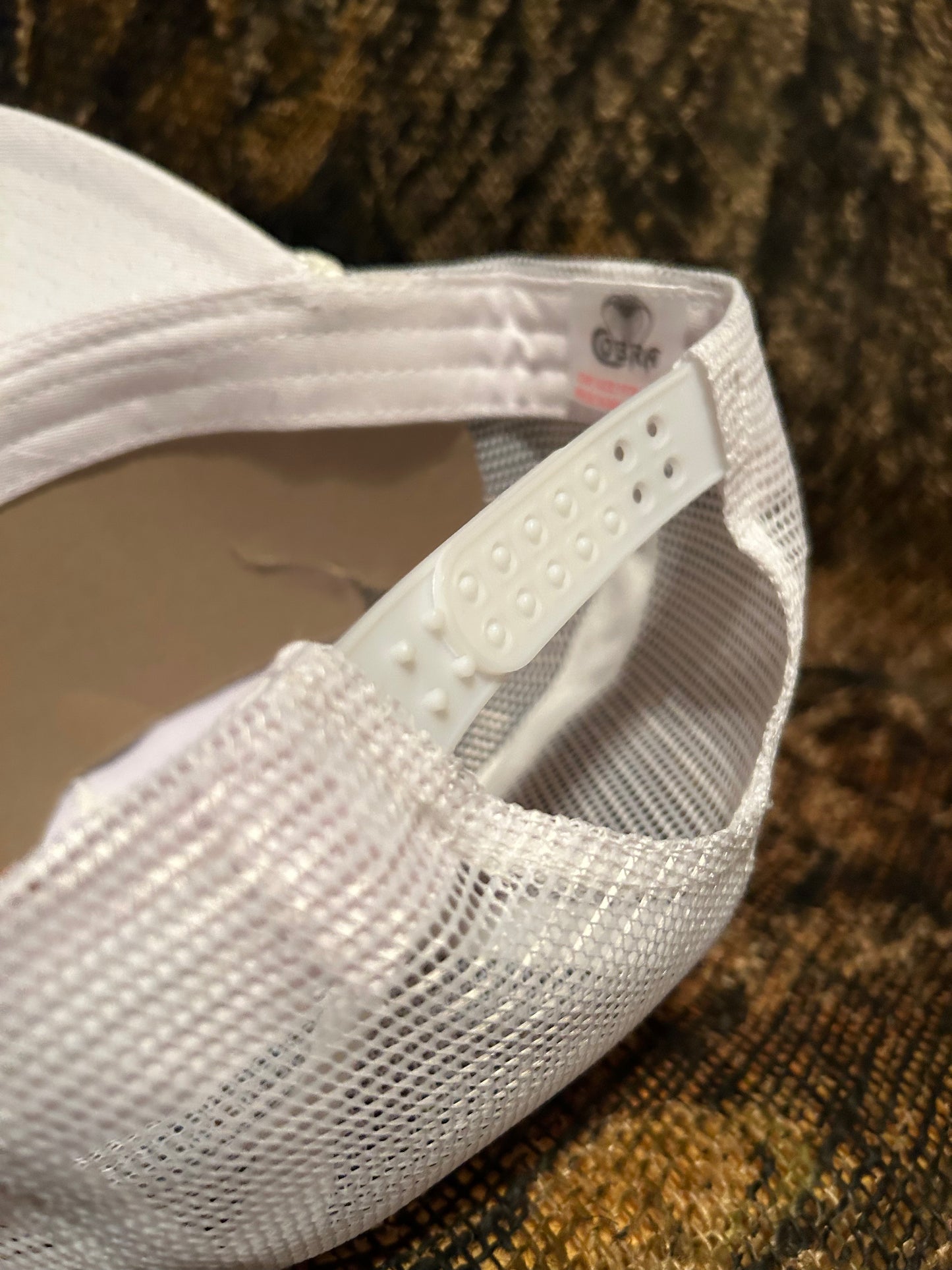 Cummins Turbo Diesel patch on a all white Ropebrim SnapBack hat