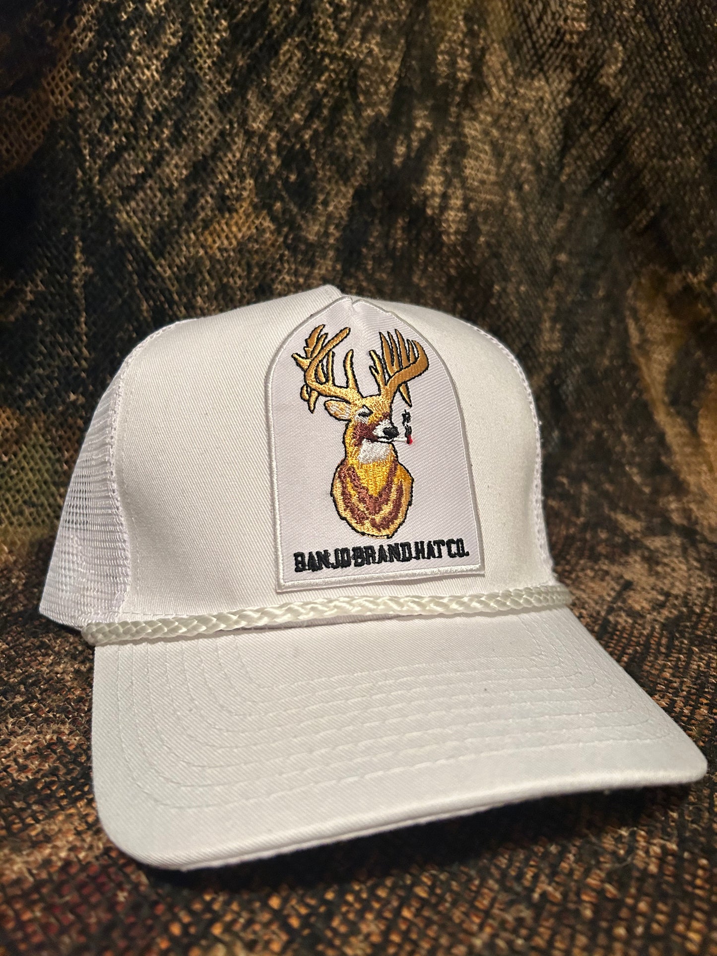 Banjo Brand smokin’whitetail patch on a white white rope brim snapback hat