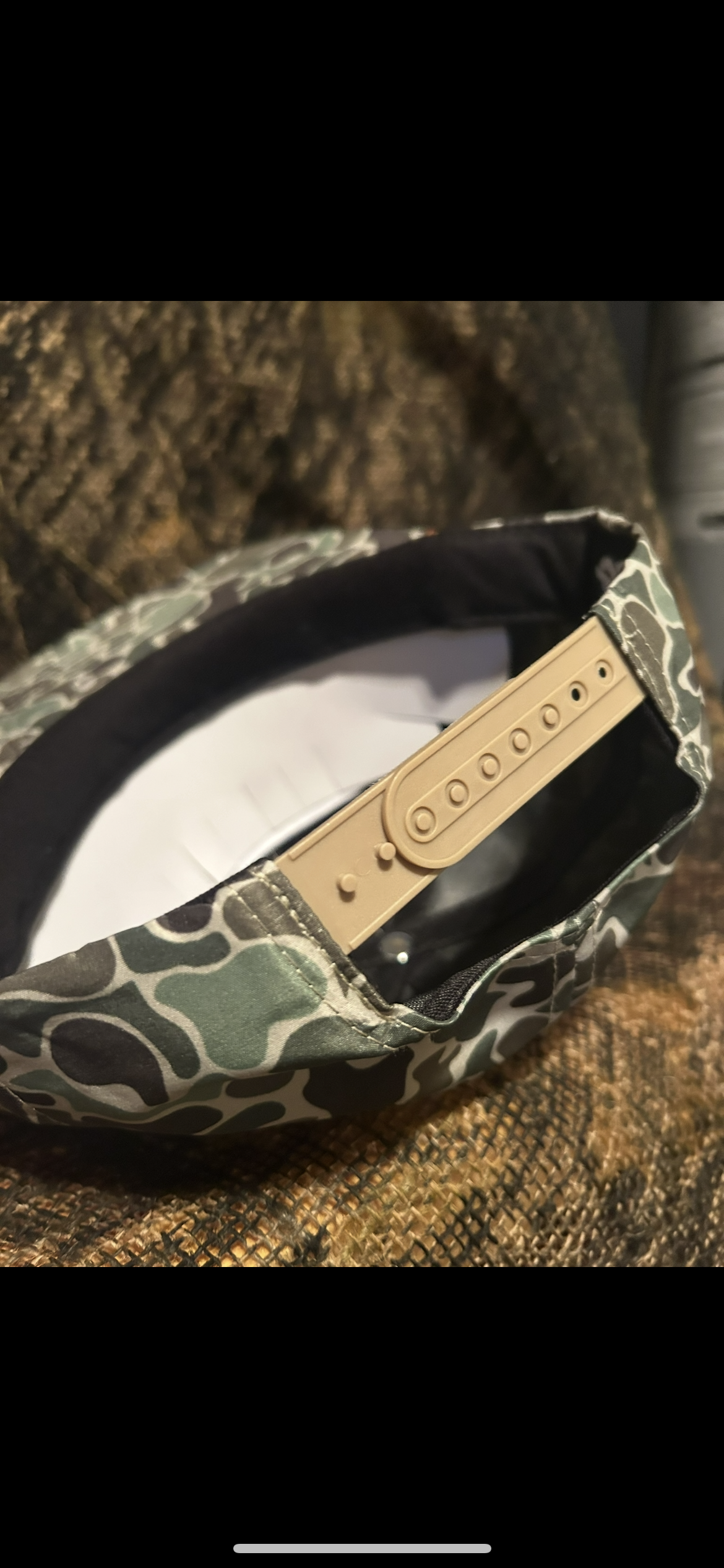 Coors gold patch on a green camo SnapBack hat