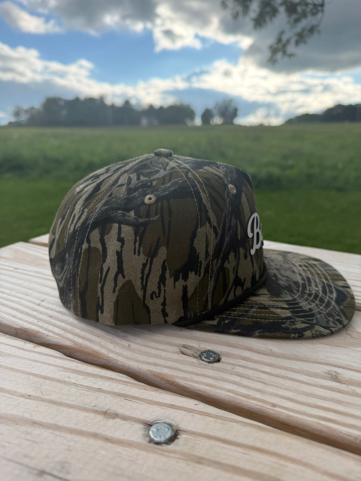 Banjo Cursive font mossyoak treestand camo SnapBack hat
