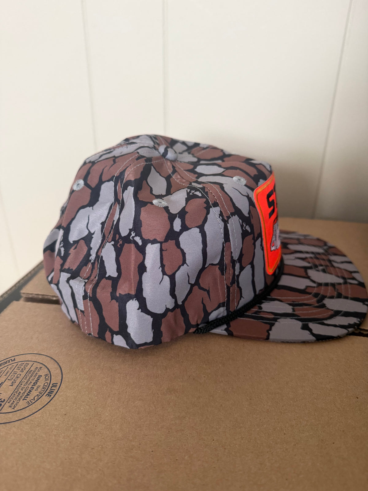STIHL chainsaw patch on a oak camo ropebrim SnapBack hat