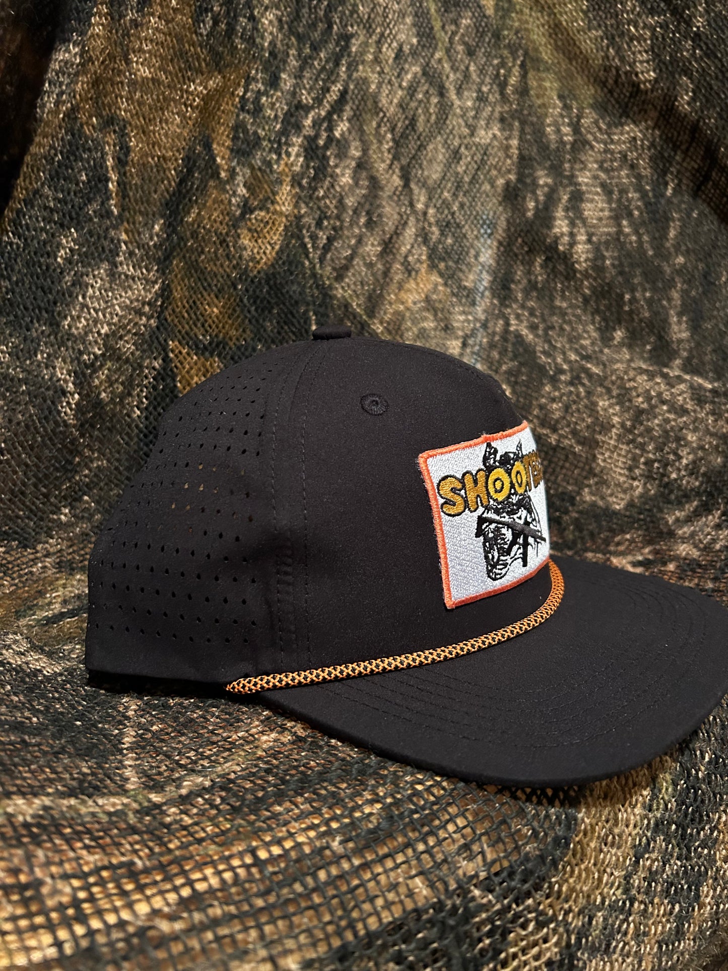 Shooters patch on a black SnapBack hat