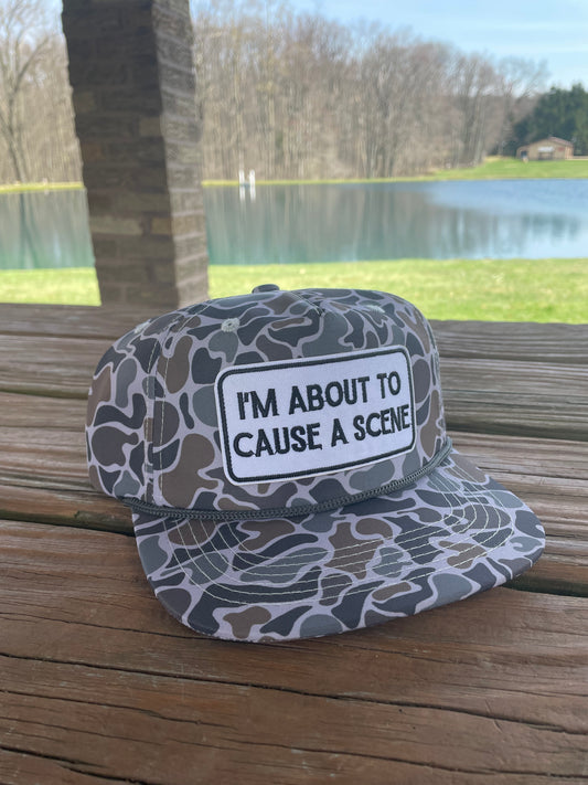 I’m about to cause a scene camo SnapBack hat