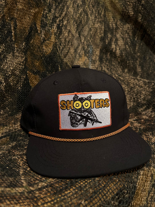 Shooters patch on a black SnapBack hat