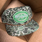 Remington patch on a jungle camo ropebrim SnapBack hat