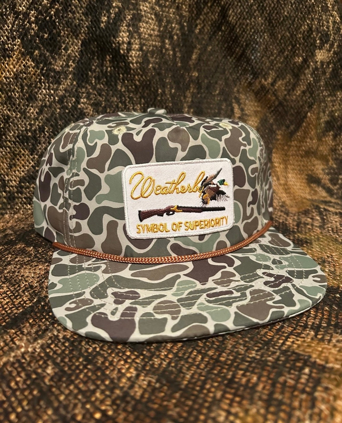 Weatherby symbol of superiority camo ropebrim SnapBack hat