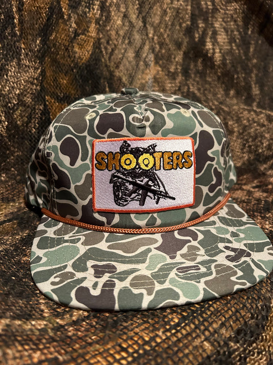 Shooters patch on a Camo SnapBack hat