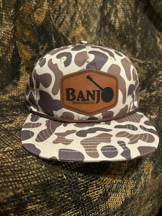Banjo Brand leather patch on a retro camo SnapBack hat