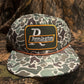 Remington patch on a Camo ropebrim SnapBack hat