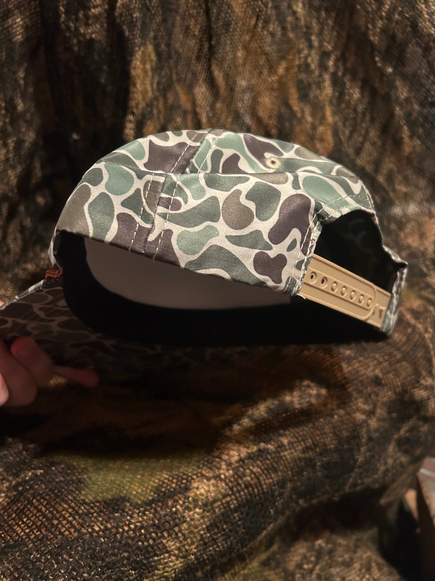 Remington patch on a Camo ropebrim SnapBack hat