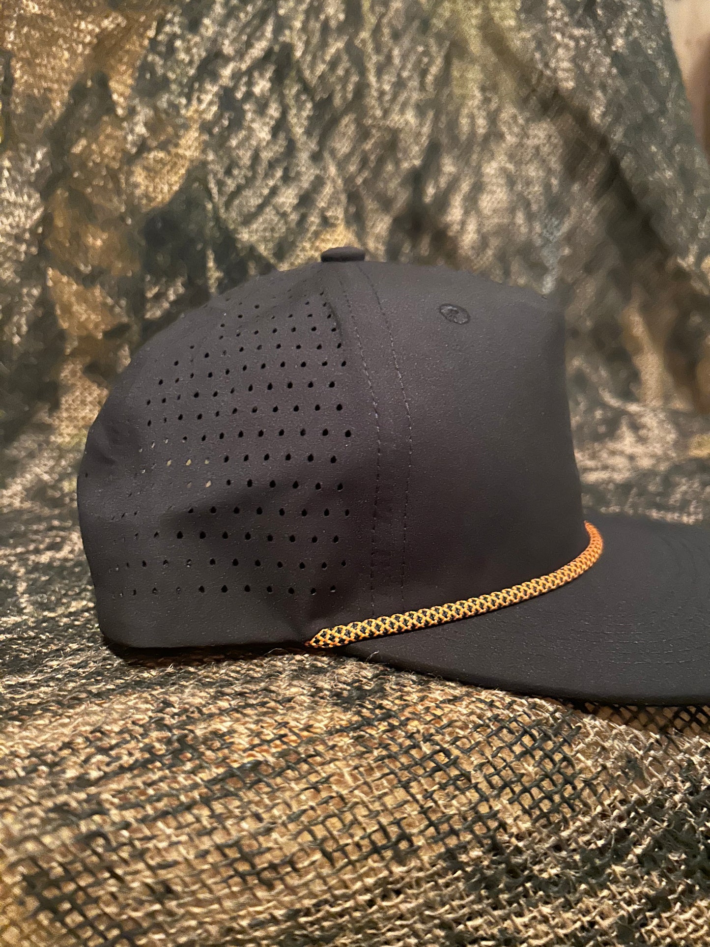 Black perforated ropebrim SnapBack hat