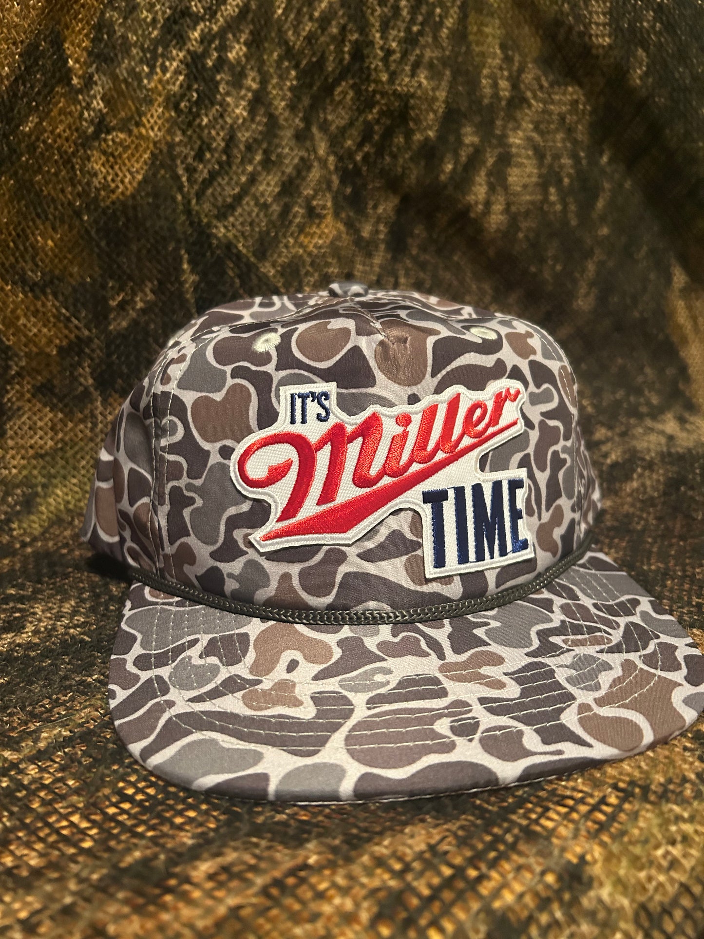 Its Miller Time retro vintage patch on a smokeshow Camo ropebrim SnapBack
