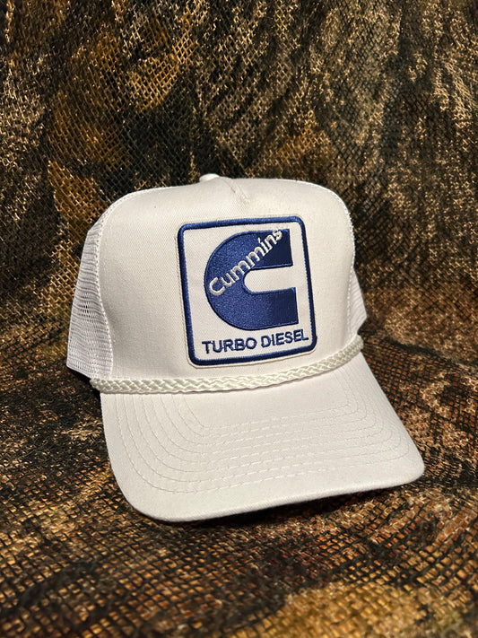 Cummins Turbo Diesel patch on a all white Ropebrim SnapBack hat