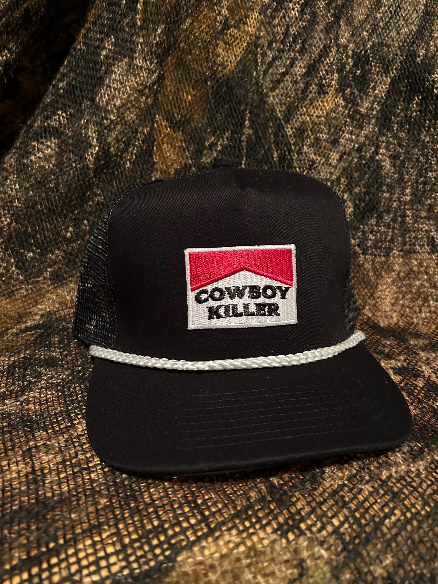 Cowboy Killer Patch on black/white rope brim snapback hat