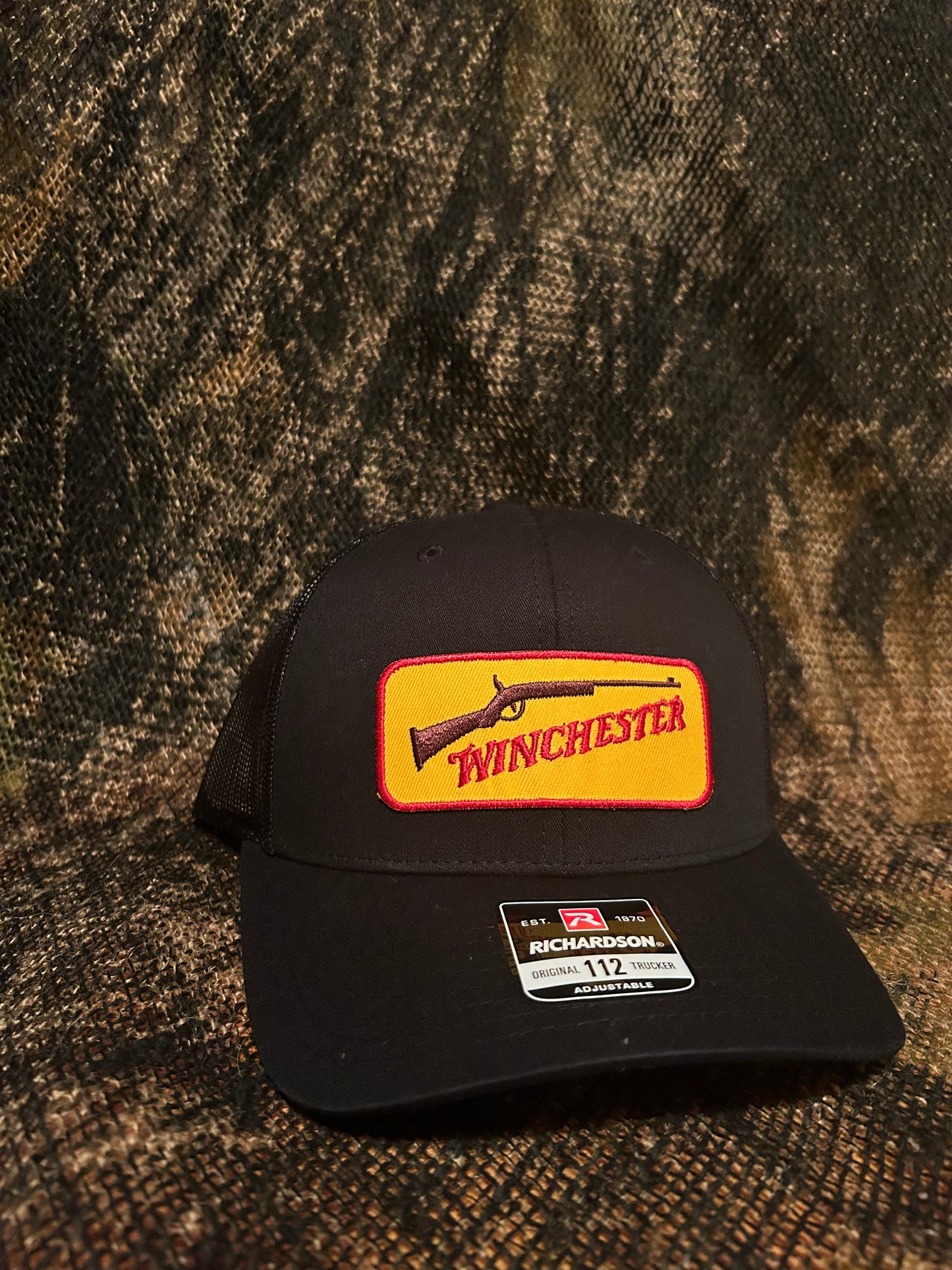 Vintage Winchester patch on a black Richardson 112 trucker hat